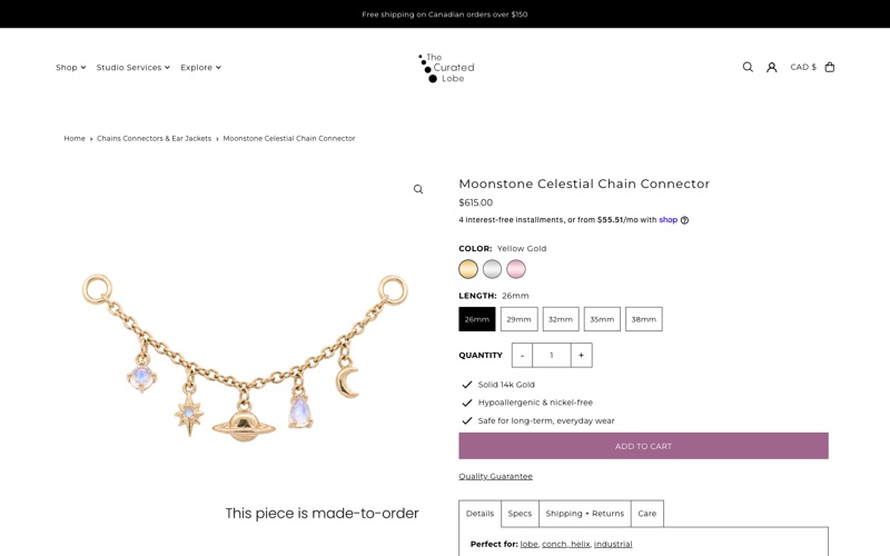 A product page on The Curated Lobe store: a gold chain with moon, star and planet charms